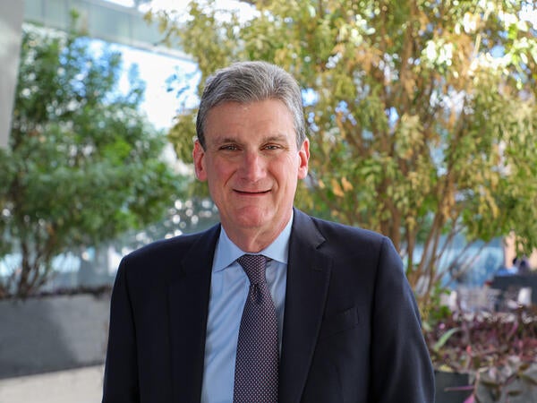 David Gelfand standing in the ASU Law courtyard